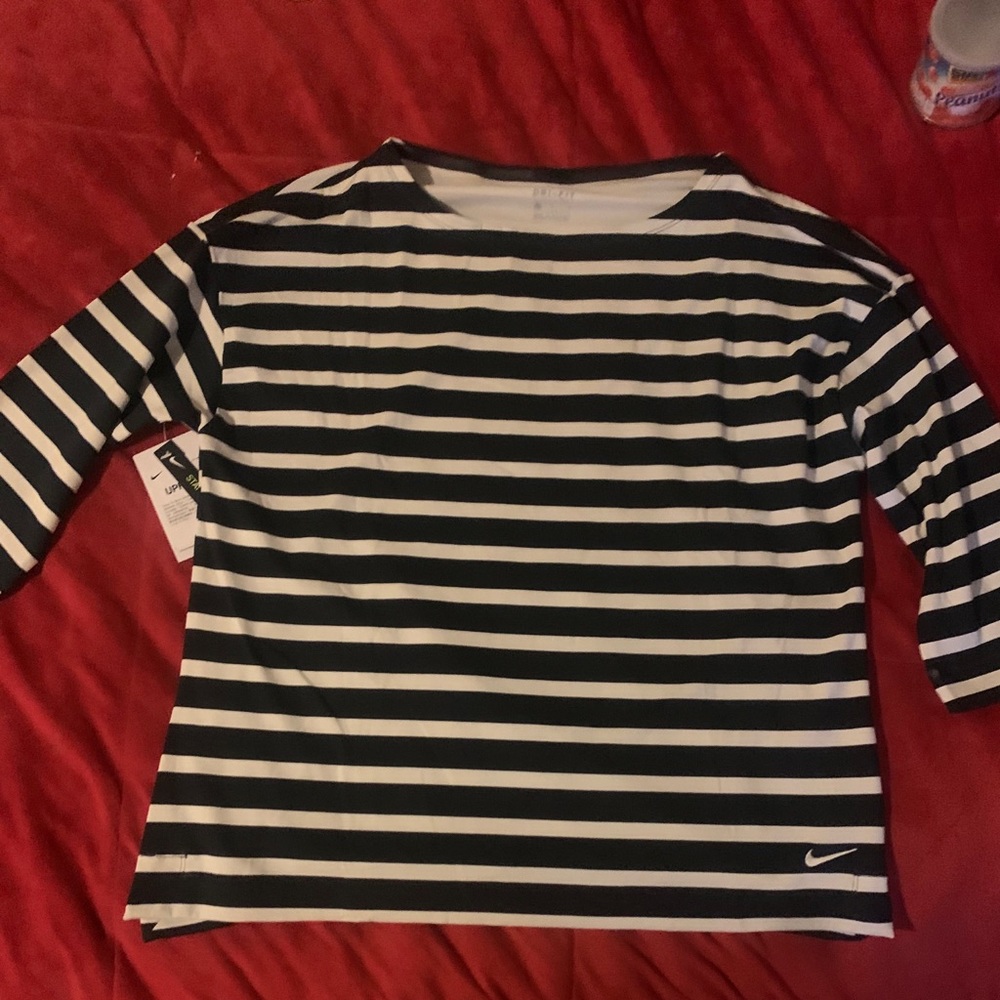 I have two brand new  Nike Dry shirts